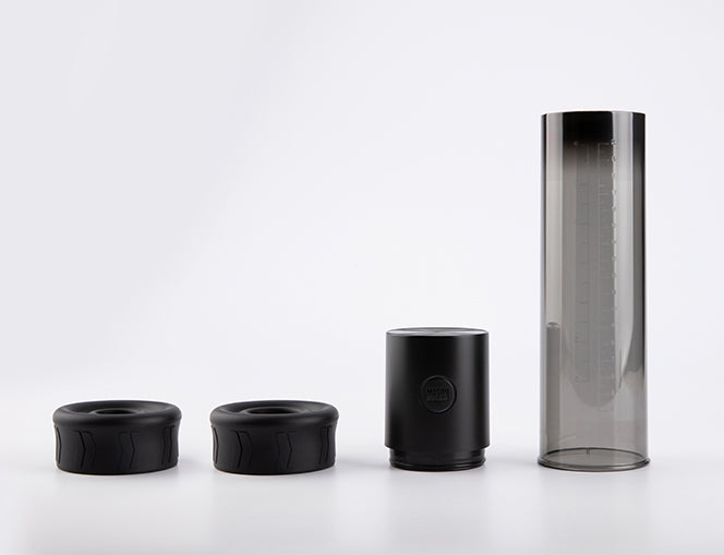 Macho Work 1 vacuum pump with interchangeable silicone rings, pump motor, and transparent measurement tube shown disassembled