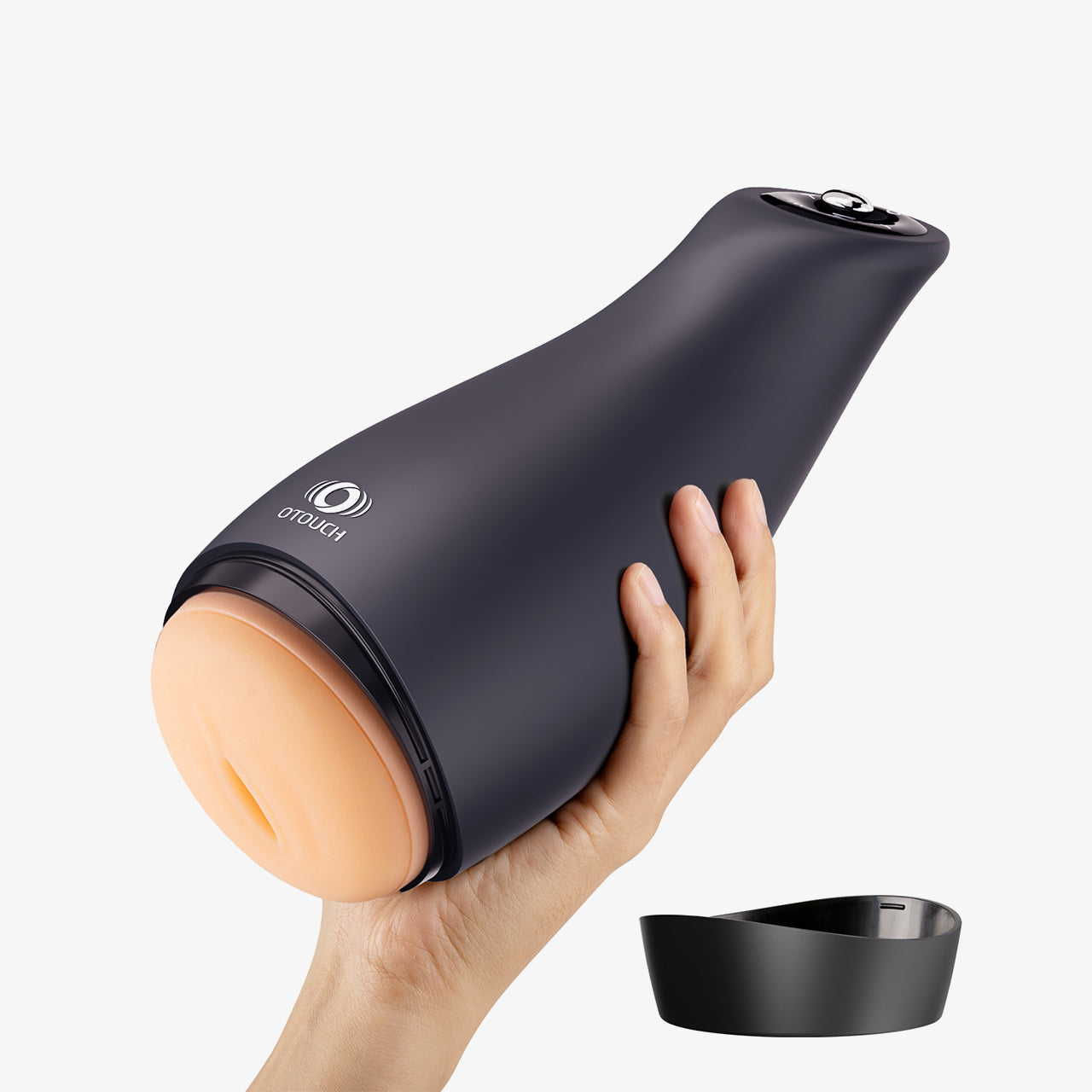 Hand holding the OTOUCH male masturbator, showing the product’s exterior design